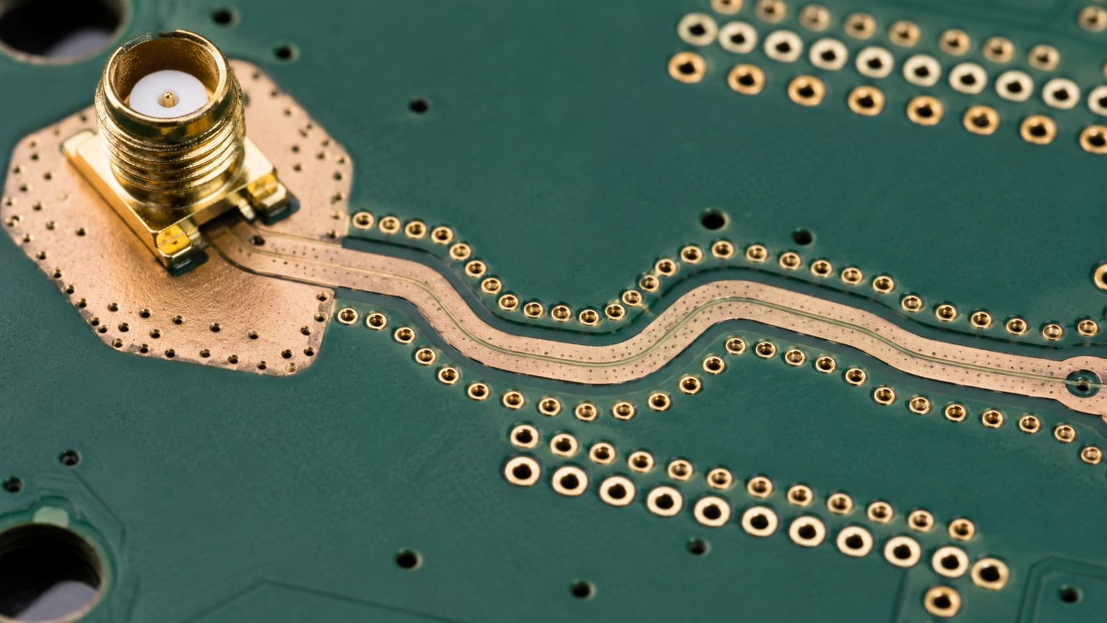 Wireless infrastructure PCB connector launch with ground vias via fence gold pads and controlled impedance trace