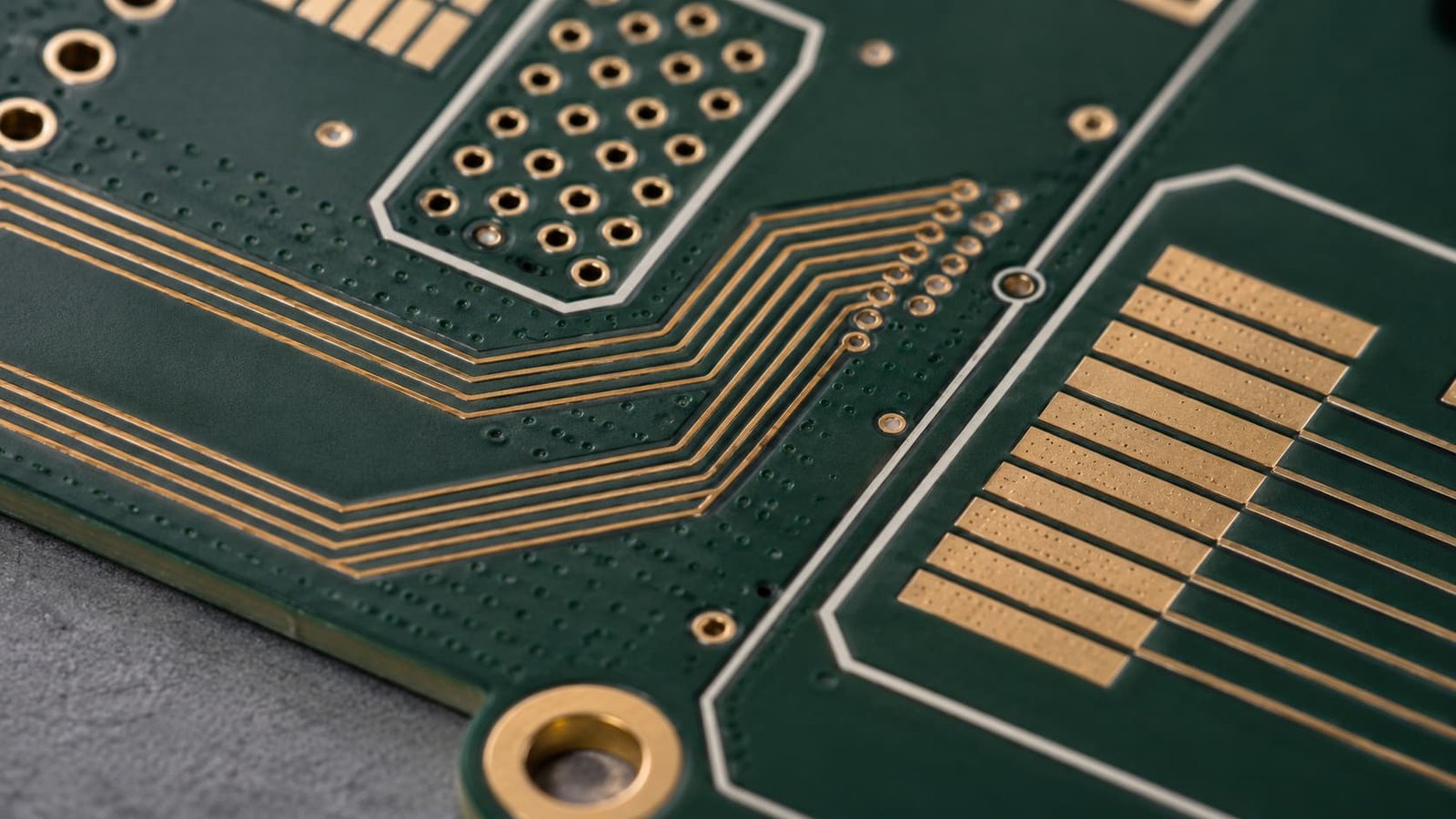 RF PCB macro detail showing controlled impedance traces copper spacing test coupon plated holes and gold pads